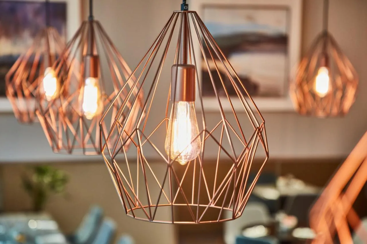 a group of lights hanging from a ceiling at Maldron Hotel Glasgow City in Glasgow